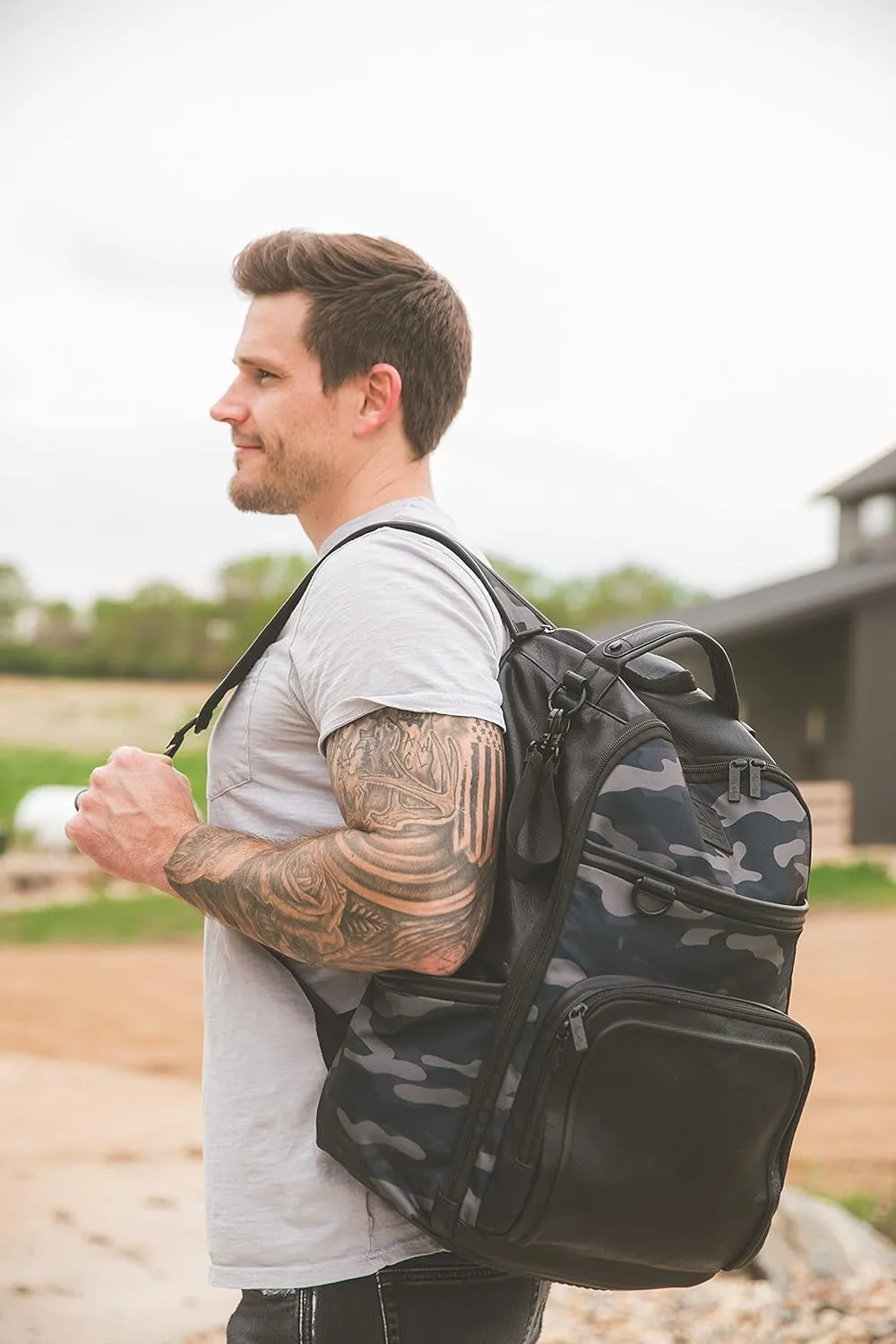 Itzy Ritzy Chelsea   Cole Diaper Bag Backpack - Large Capacity Boss Backpack Diaper Bag; Includes Changing Pad, Stroller Clips and Tassel, Camo with Stag Head Print Interior and Black Hardware